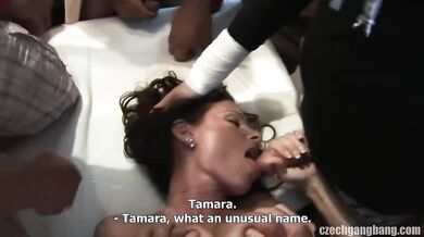 Watch her surrender to a line of hard cocks while her boyfriend stays in the corner